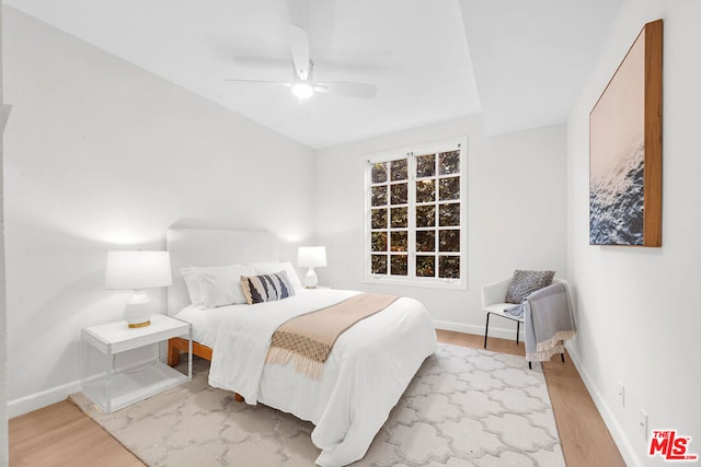 bedroom featuring ceiling fan and light wood-type flooring