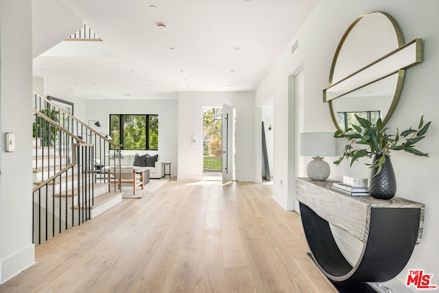 corridor featuring light hardwood / wood-style floors