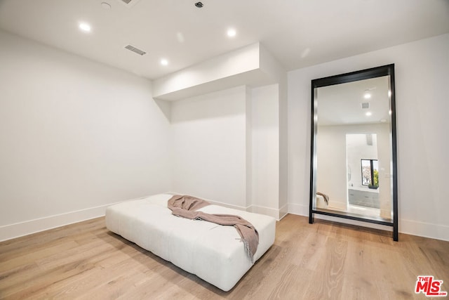 bedroom featuring light hardwood / wood-style floors