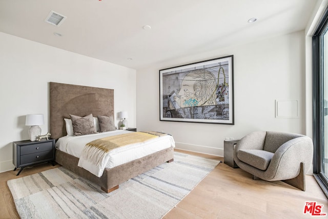 bedroom featuring light hardwood / wood-style floors