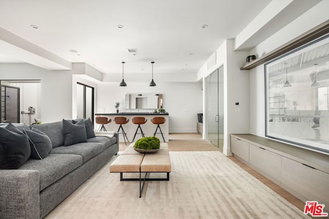 living room with light hardwood / wood-style floors