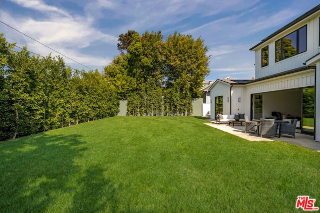 view of yard with an outdoor hangout area and a patio area