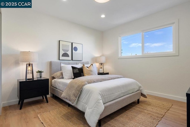 bedroom with light hardwood / wood-style flooring