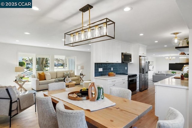 dining space with light hardwood / wood-style floors