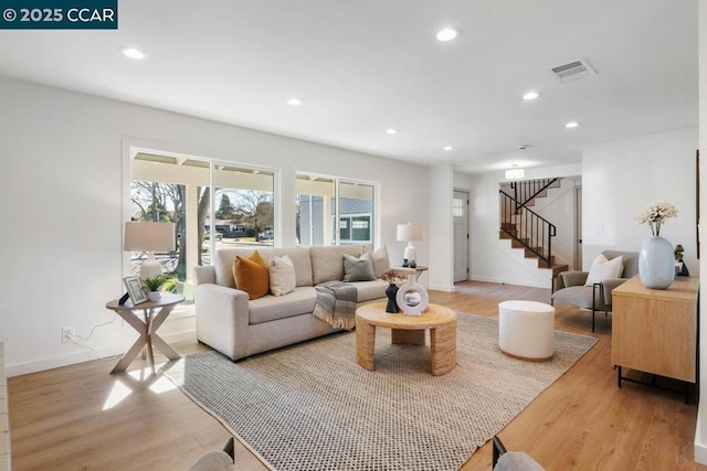 living room with light hardwood / wood-style flooring