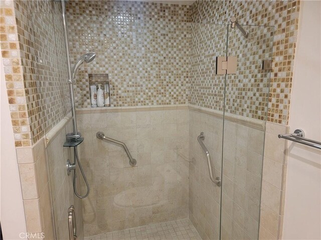 bathroom with a shower stall