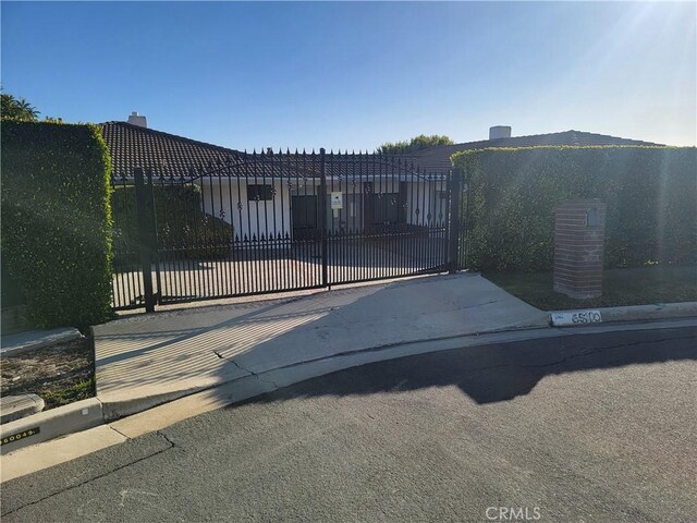 view of gate featuring fence