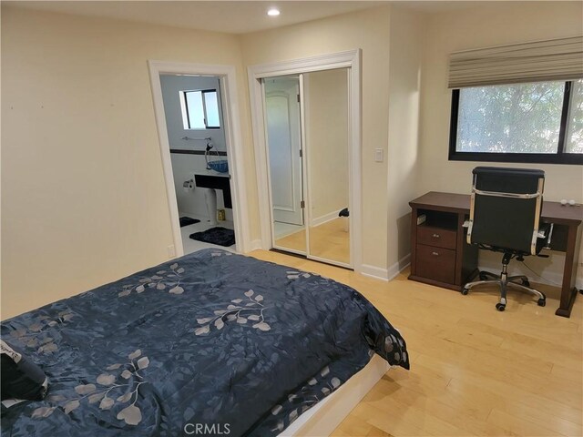 bedroom featuring recessed lighting, baseboards, and light wood finished floors