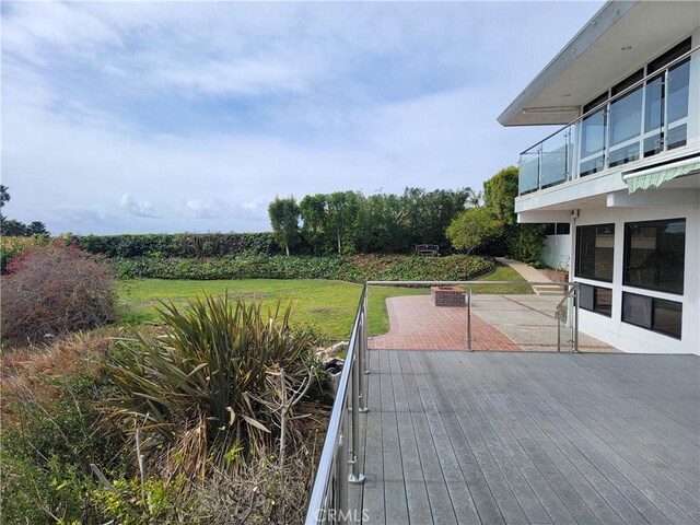 deck featuring a lawn