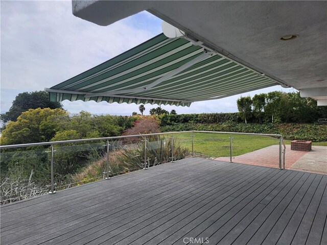 deck featuring a yard and a patio