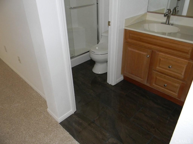 bathroom with toilet, an enclosed shower, and vanity