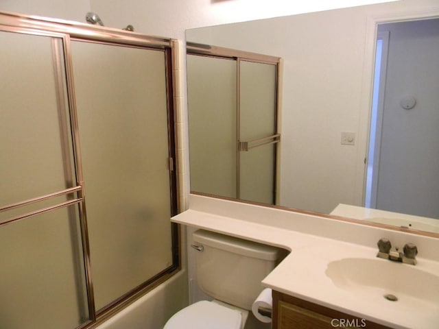 full bathroom with toilet, vanity, and combined bath / shower with glass door