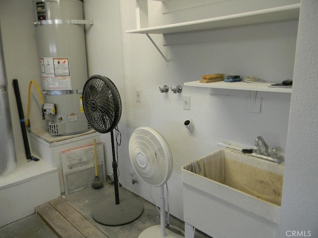 washroom with sink and water heater