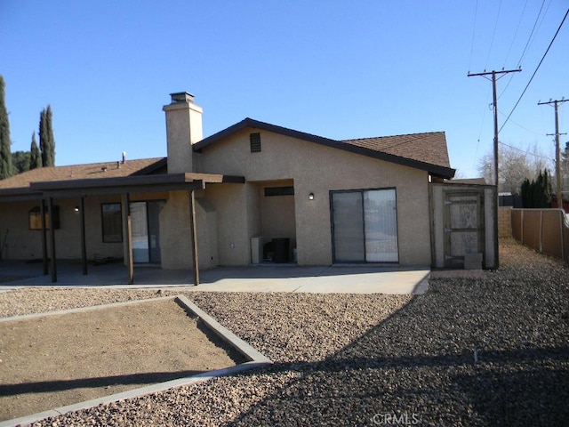 rear view of house with a patio