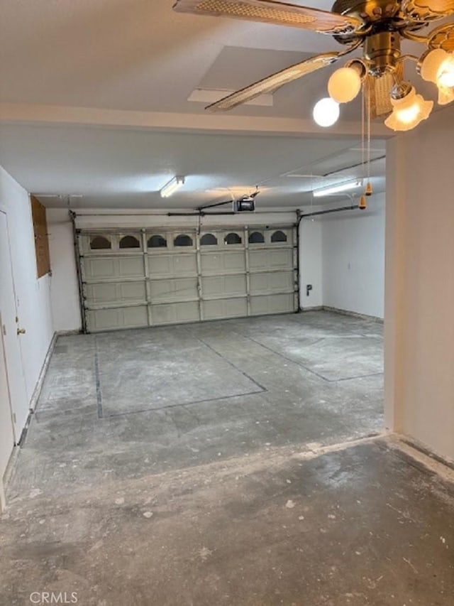 garage featuring a garage door opener and ceiling fan