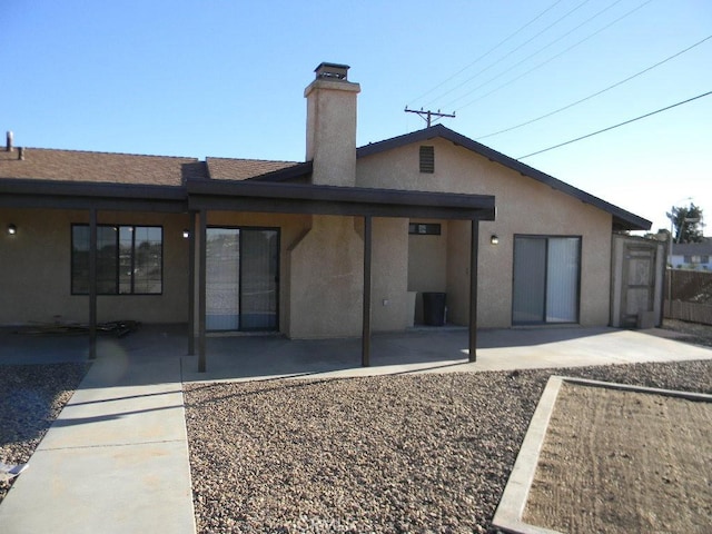 back of property featuring a patio area