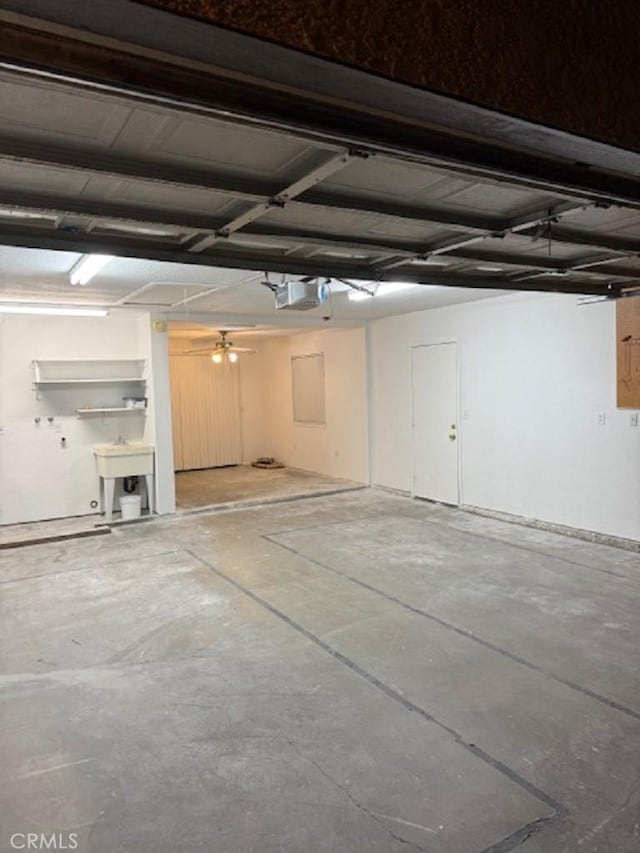 garage featuring a garage door opener and sink