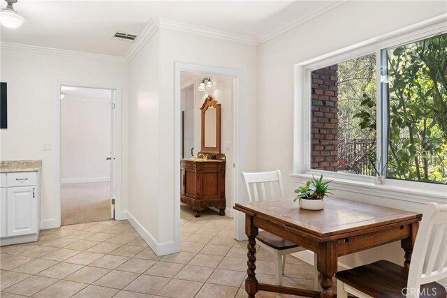 tiled dining space with ornamental molding