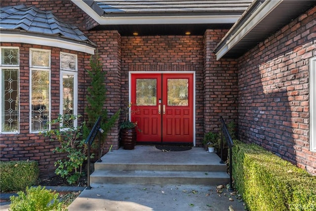 view of exterior entry featuring french doors