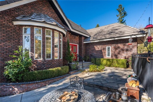 doorway to property with a patio area