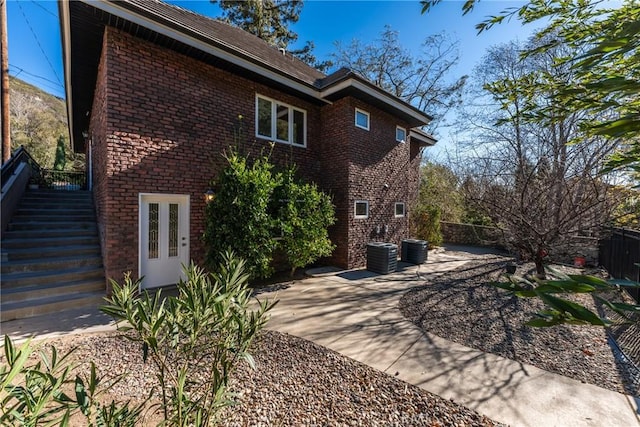 exterior space featuring a patio and central AC