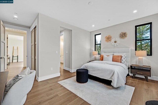 bedroom with light hardwood / wood-style floors