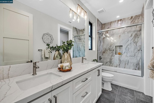 full bathroom with toilet, tile patterned floors, combined bath / shower with glass door, and vanity