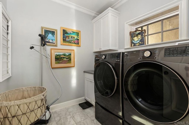 laundry room featuring separate washer and dryer, cabinets, and ornamental molding