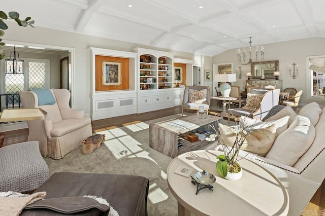 living room featuring coffered ceiling, a chandelier, hardwood / wood-style flooring, and beam ceiling