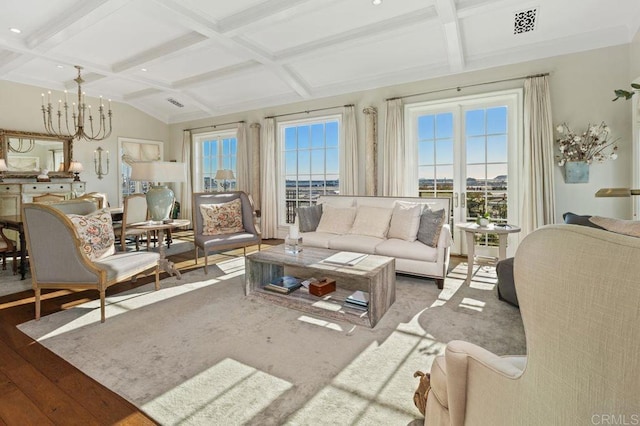 sunroom with beamed ceiling, coffered ceiling, and a chandelier