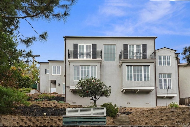 2045 W California St, San Diego, CA 92110 - view of front facade with a balcony and stucco siding