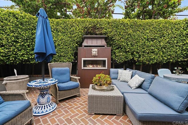 2045 W California St, San Diego, CA 92110 - view of patio with an outdoor living space with a fireplace