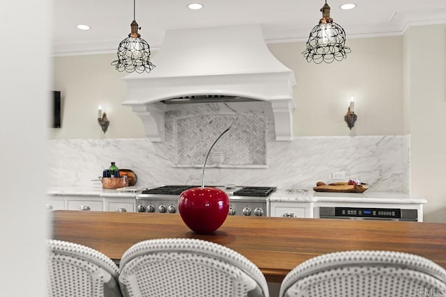2045 W California St, San Diego, CA 92110 - kitchen with wooden counters, crown molding, oven, hanging light fixtures, and custom exhaust hood
