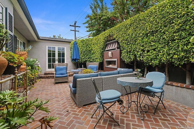 2045 W California St, San Diego, CA 92110 - view of patio / terrace with french doors and an outdoor living space with a fireplace
