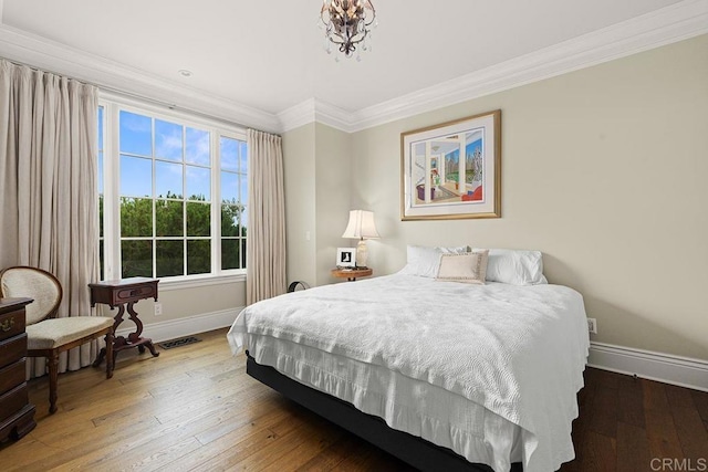2045 W California St, San Diego, CA 92110 - bedroom featuring baseboards, ornamental molding, and wood-type flooring