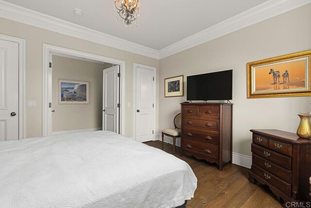 2045 W California St, San Diego, CA 92110 - bedroom featuring dark wood-type flooring, crown molding, baseboards, and a chandelier