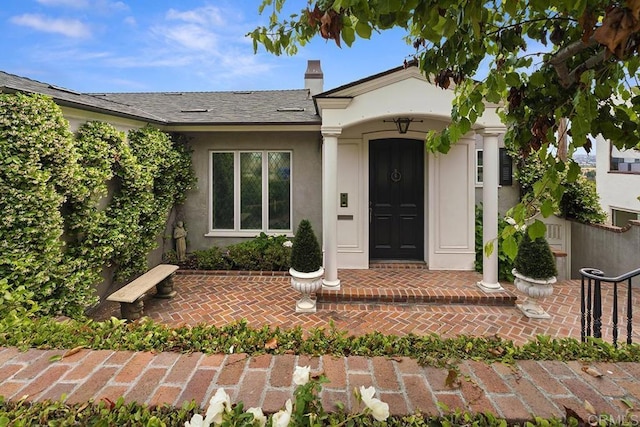2045 W California St, San Diego, CA 92110 - property entrance featuring stucco siding, a chimney, and roof with shingles