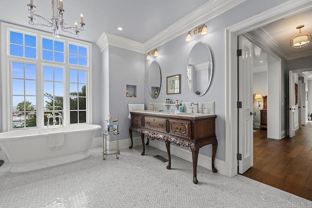 2045 W California St, San Diego, CA 92110 - full bathroom featuring ornamental molding, double vanity, a freestanding tub, a chandelier, and baseboards