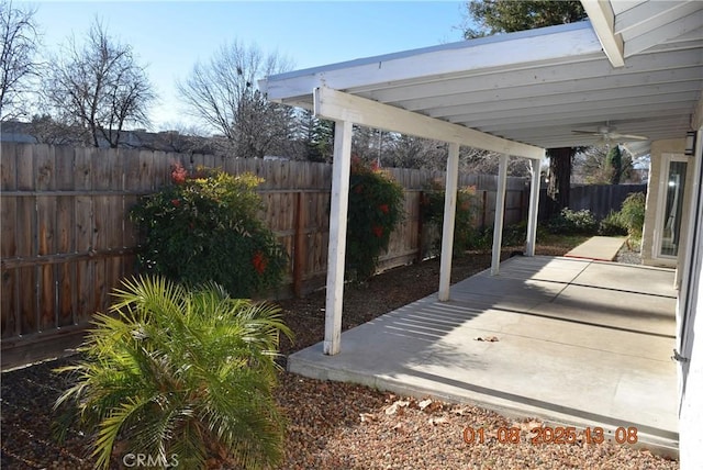 view of patio / terrace featuring ceiling fan and a pergola