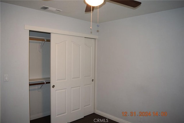 unfurnished bedroom featuring a closet and ceiling fan