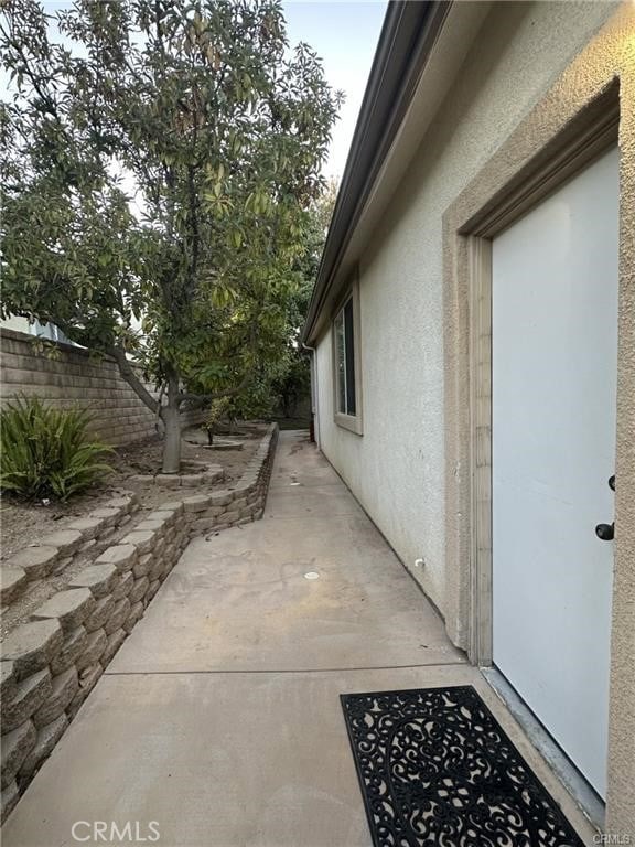 view of property exterior featuring a patio