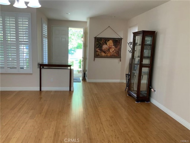 interior space featuring a chandelier and hardwood / wood-style flooring