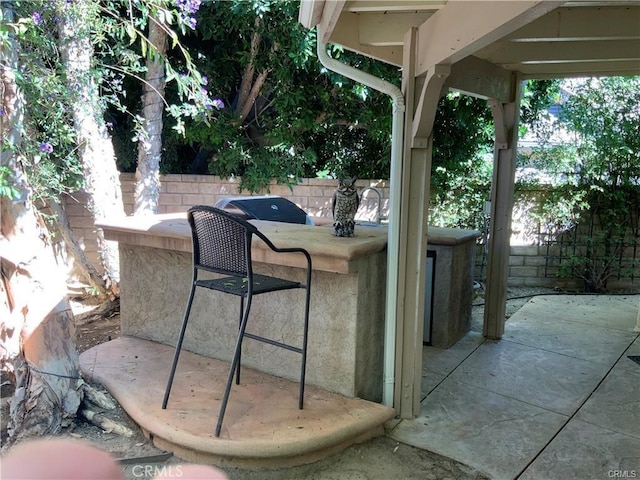 view of patio with a bar