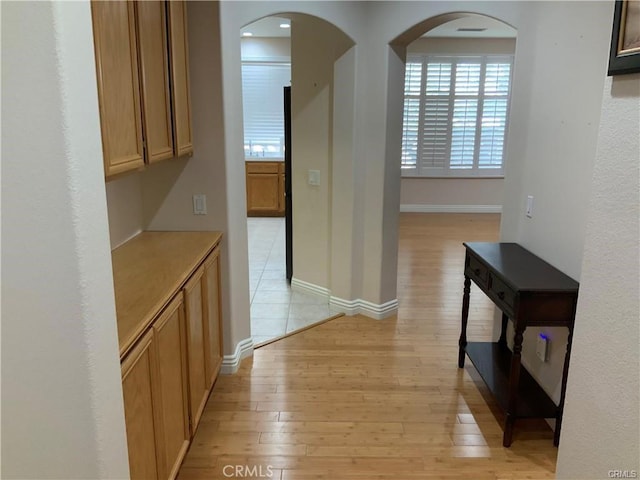 hall with light hardwood / wood-style flooring