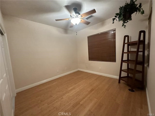 unfurnished bedroom featuring ceiling fan and hardwood / wood-style flooring