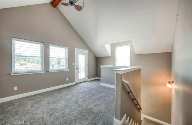 additional living space featuring vaulted ceiling with beams, ceiling fan, and carpet