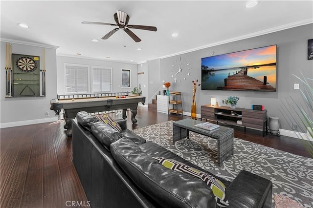 living room featuring pool table, ornamental molding, ceiling fan, and dark wood-type flooring