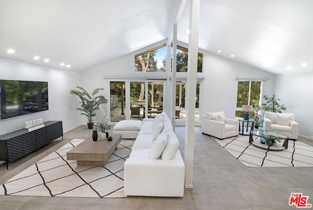 tiled living room with high vaulted ceiling