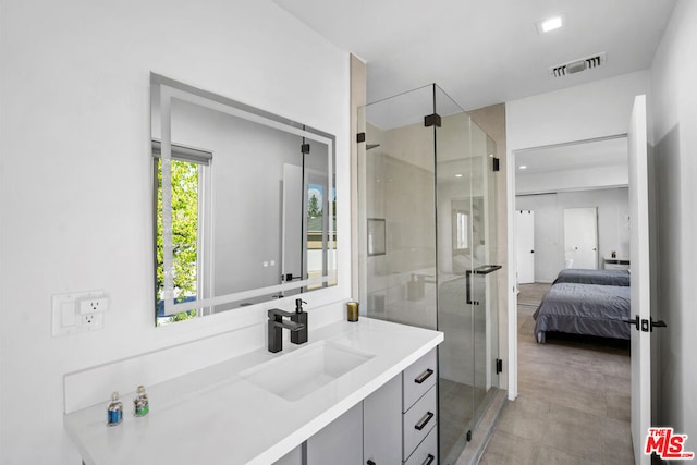 bathroom featuring walk in shower and vanity