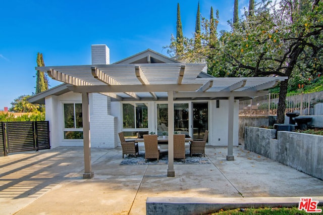 rear view of house featuring an outdoor living space, a patio area, and a pergola